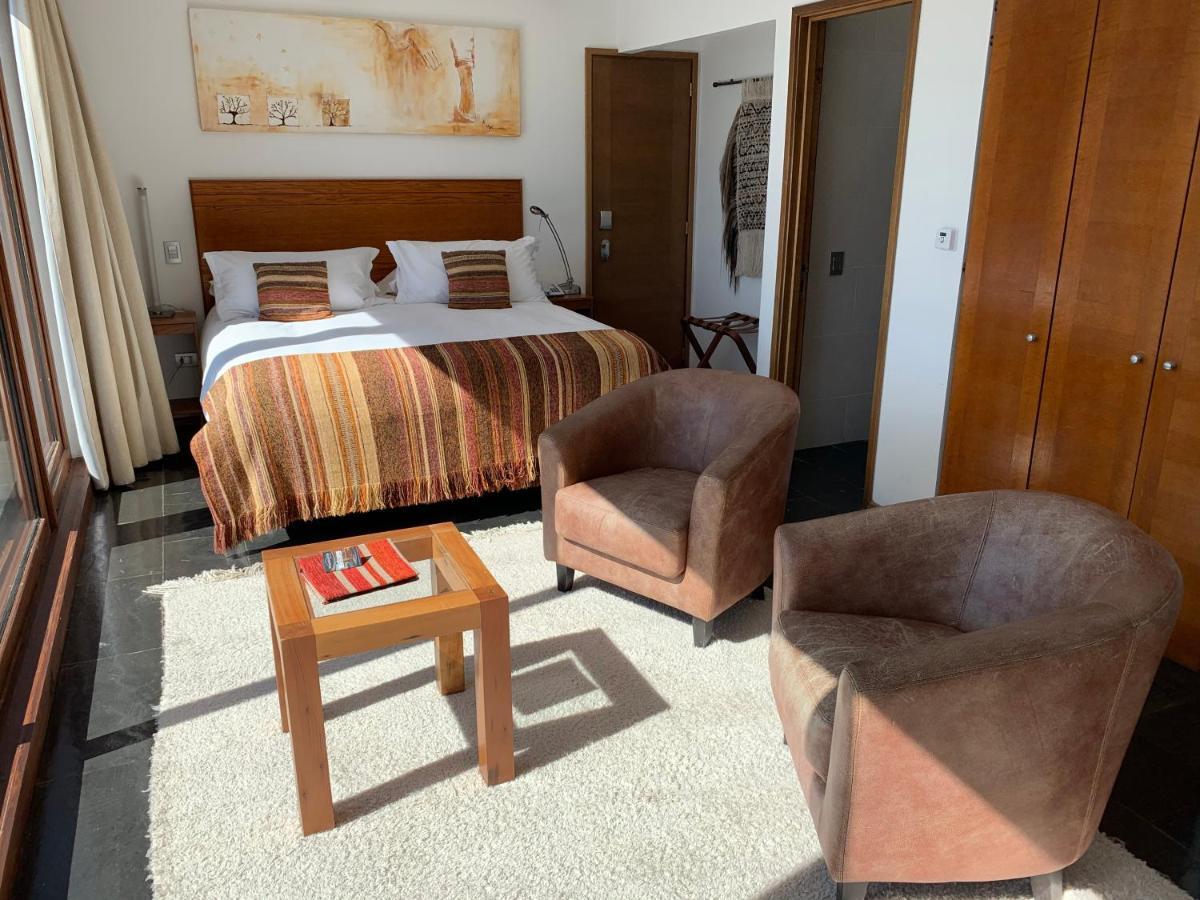 Hotel Playa Grande Suites Пукон Экстерьер фото